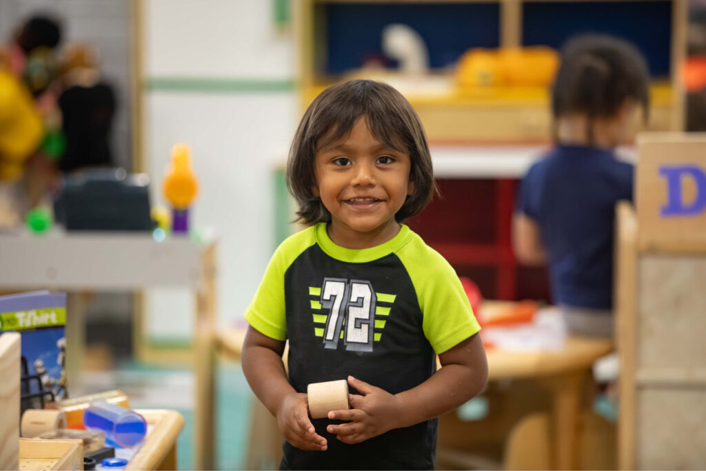 Preschool-aged Latino boy in classroom